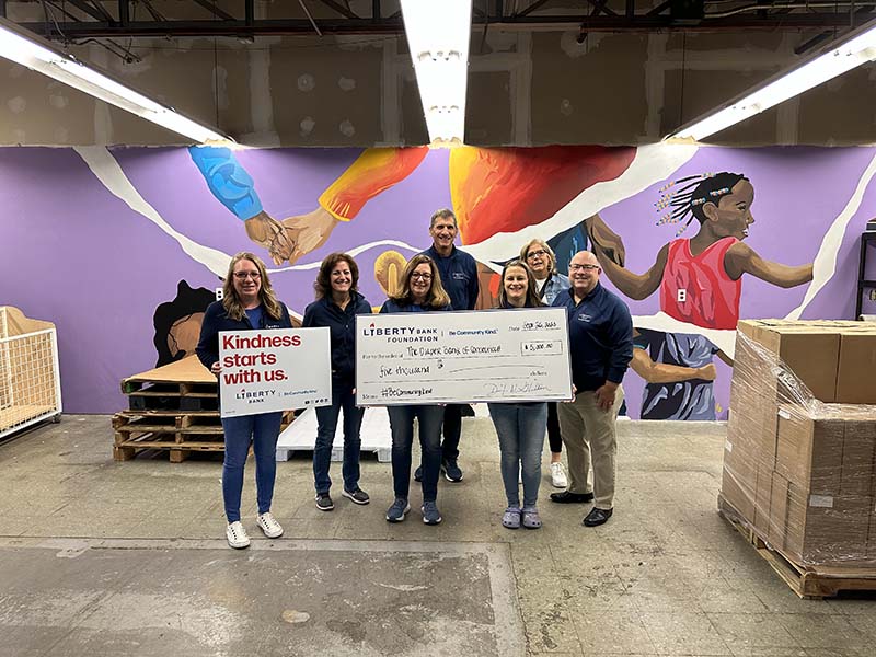 Sevearl Liberty Bank employees at a check presentation at the Diaper Bank