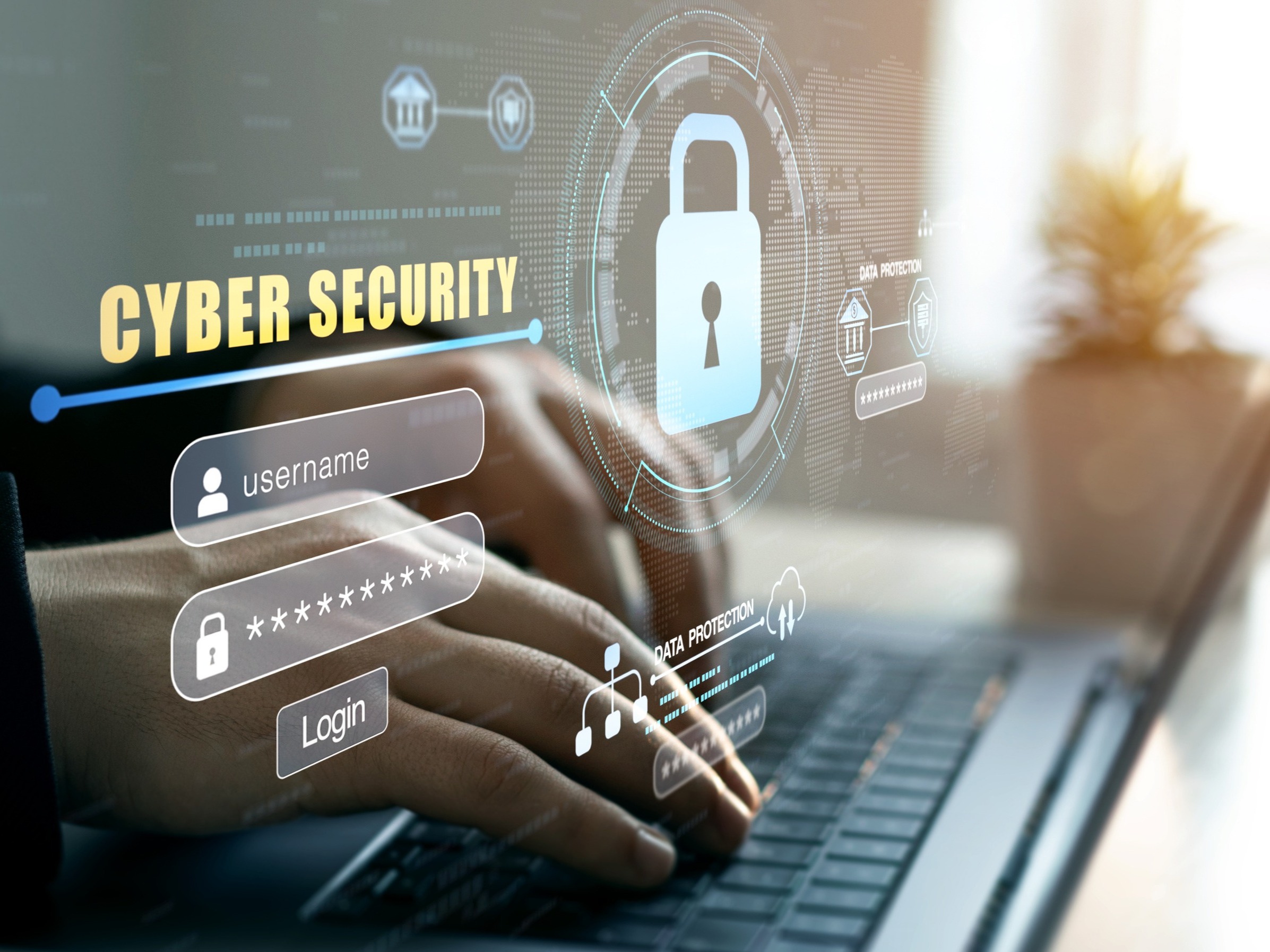 person typing on laptop with cyber security graphics
