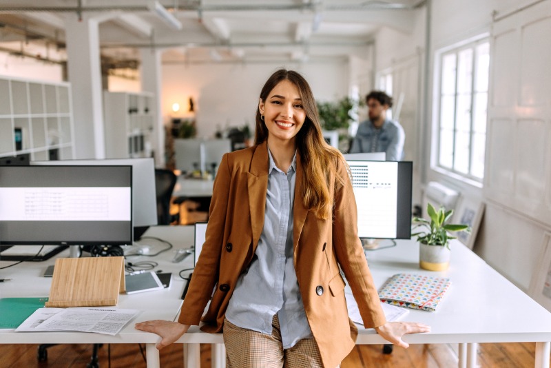 Young woman in open plan office