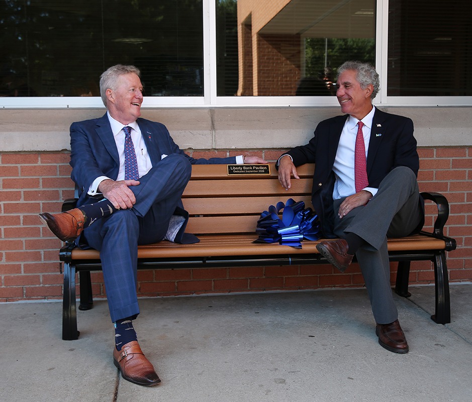 two men sitting on a bench at Middlesex Health Cancer Center