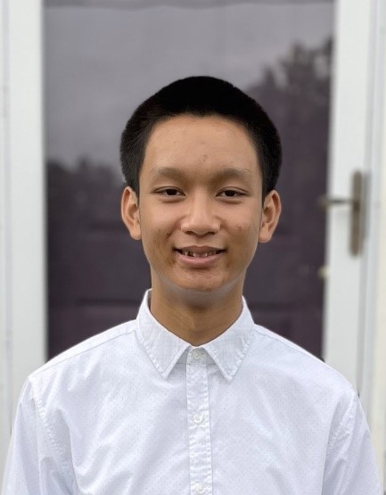 young man in white shirt facing camera