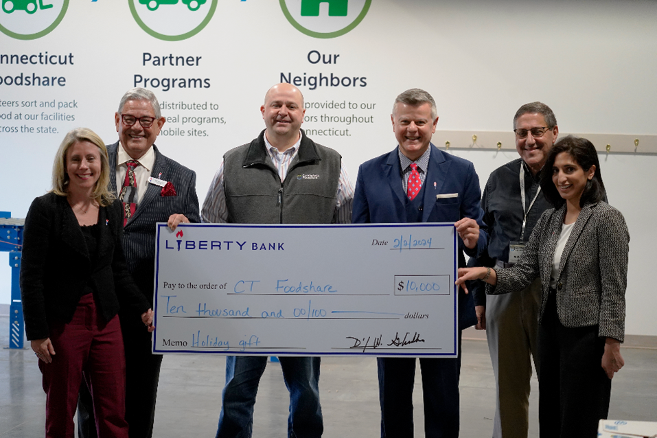 Foodshare Six people holding a giant $10,000 check