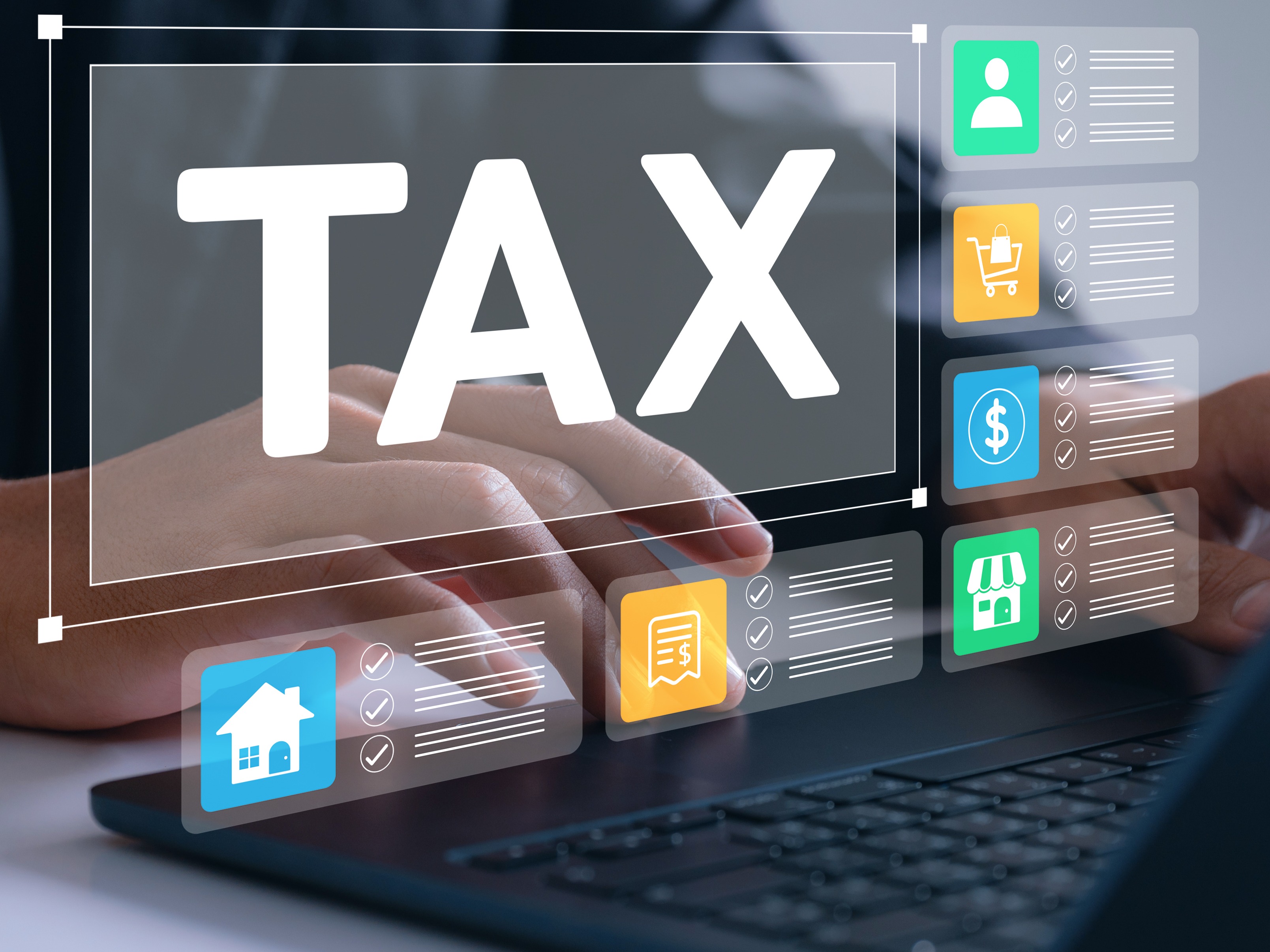 Person on laptop with graphic of tax screen